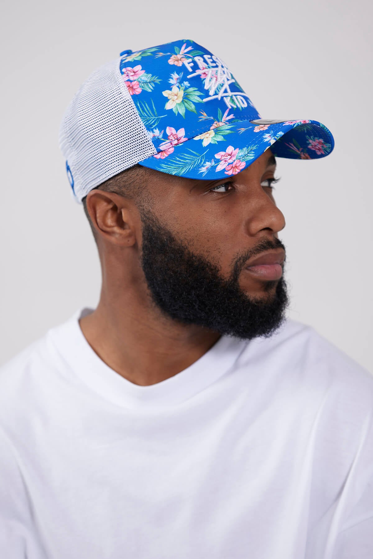 Fresh Ego Kid New Era flower print trucker in blue